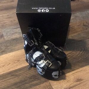 Lamoda skeleton platform shoes with chains.